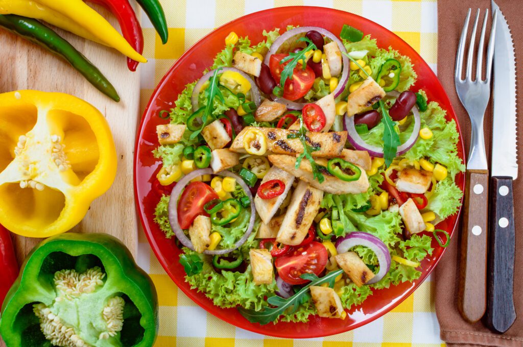 mexican spicy chicken salad plate grilled chicken meat with tasty selection vegetables scaled