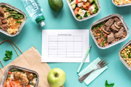 Nutrition plan with prepared healthy meals and fresh ingredients