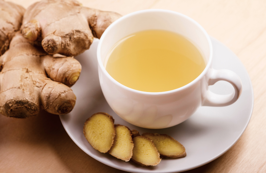 Ginger tea in white cup with fresh ginger root - ginger tea for weight loss