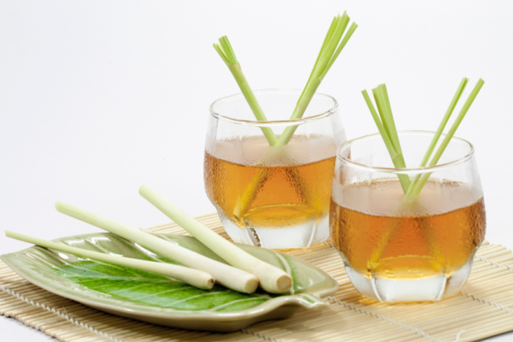 Lemongrass tea in glasses with fresh lemongrass stalks - lemongrass tea for weight loss