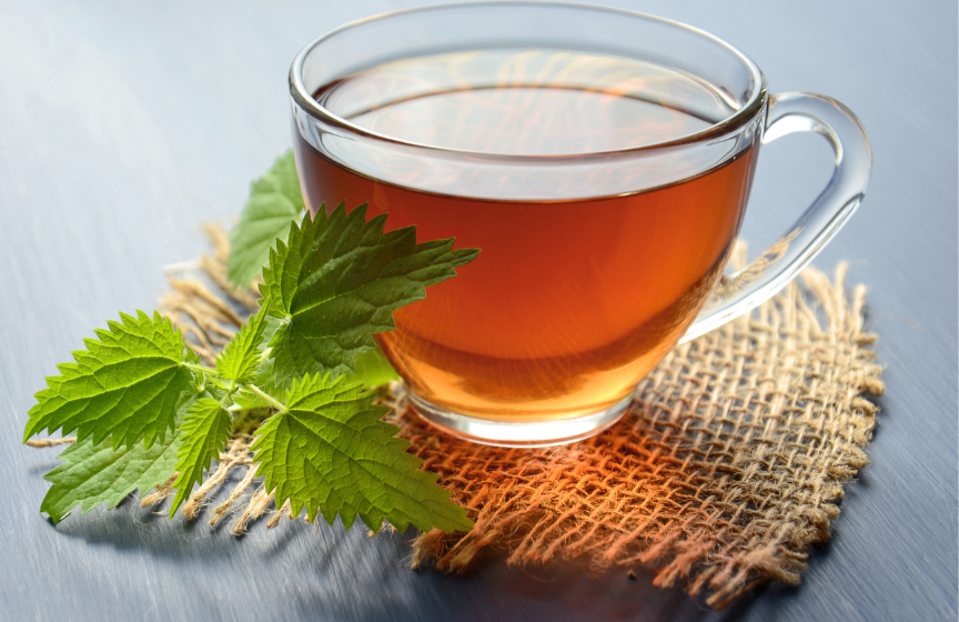 Oolong tea in glass cup with fresh leaves - oolong tea for weight loss